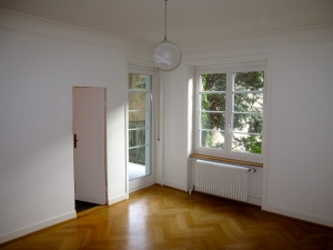 Master bedroom, doors to balcony and bathroom